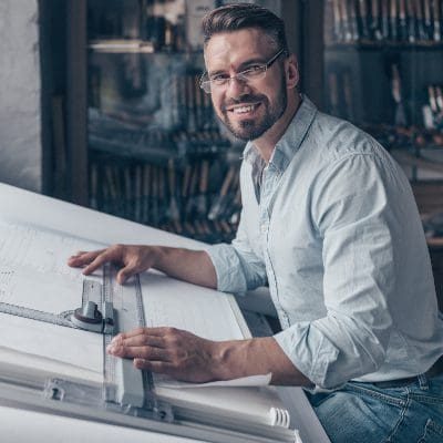 smiling-architect-at-work-SZNUQPK.jpg